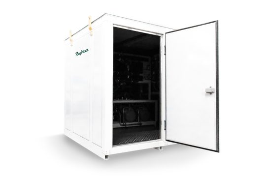 industrial liquid cooled chiller for refrigeration systems manufactured by refra in a white walk in container with open door