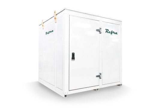 industrial liquid cooled chiller for refrigeration systems manufactured by refra in a white walk in container