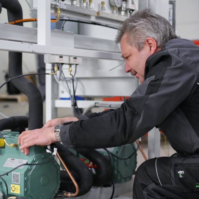 Refrigeration factory worker, assembling refrigeration equipment in Refra factory in Lithuania