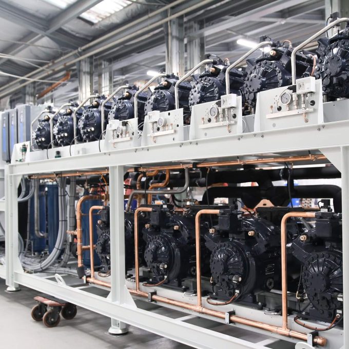 A CO2 refrigeration system rack with blue Dorin compressors, standing in Refra factory in Lithuania