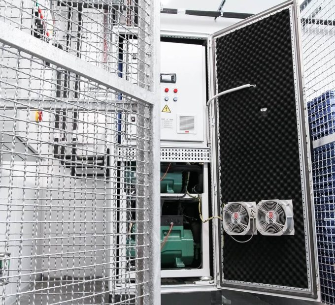 Refra CO2 commercial refrigeration system rack, standing installed at the supermarket technical room, opened.